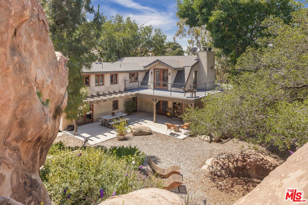 7336 Studio Road West Hills, CA 91304 - Photo 35 of 56 a front view of a house with a yard