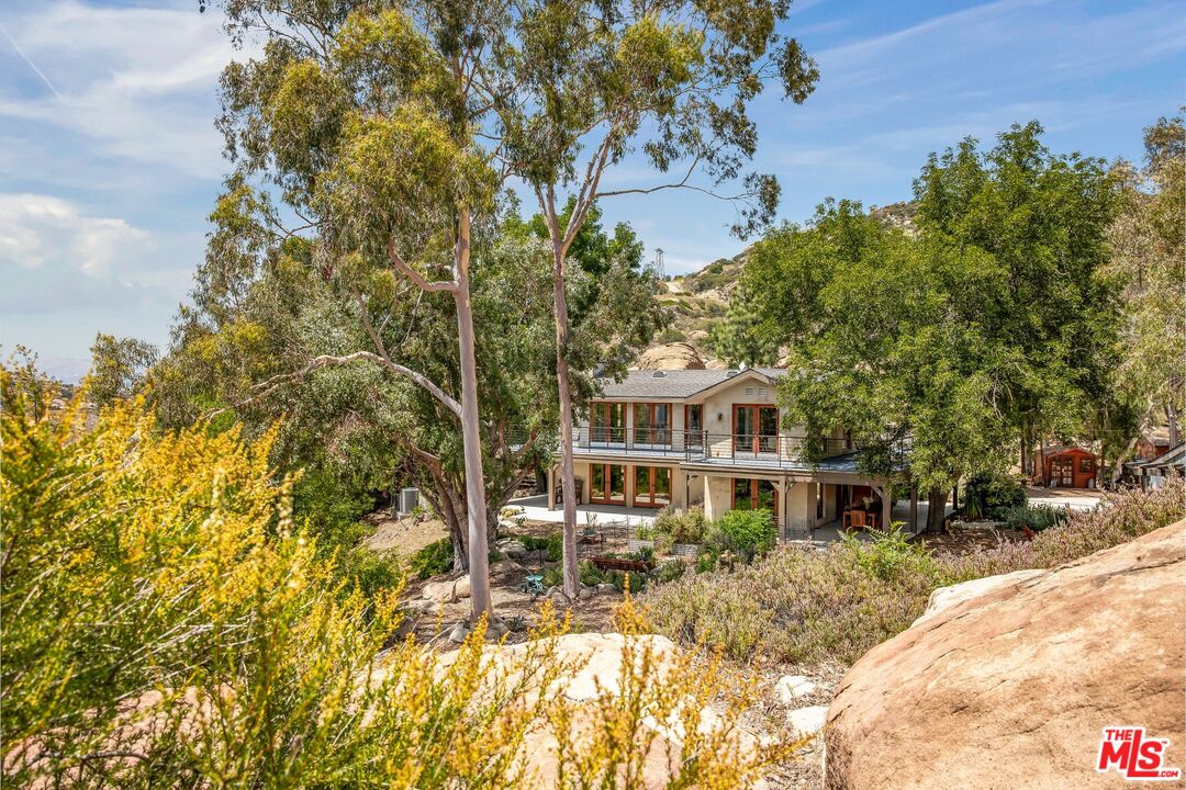 7336 Studio Road West Hills, CA 91304 - Photo 40 of 56 a view of a house with a yard