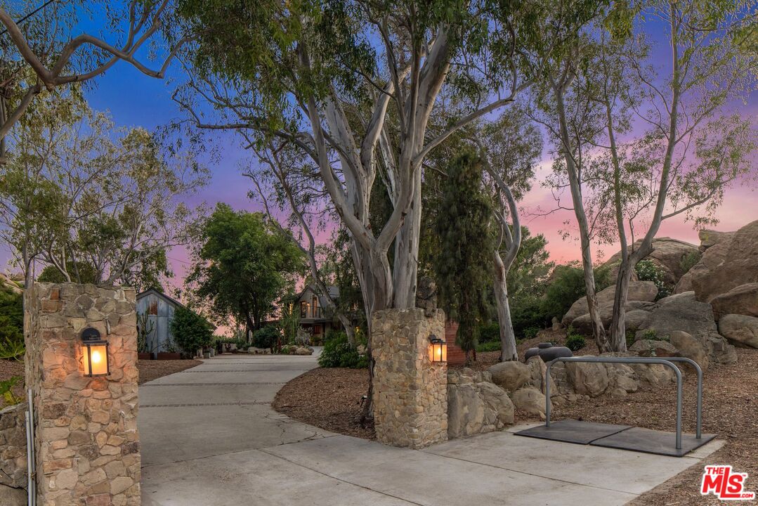 7336 Studio Road West Hills, CA 91304 - Photo 42 of 56 a tree in the middle of a yard