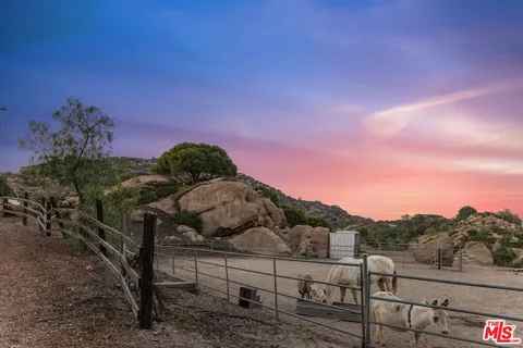 a view of a chairs and table in a patio