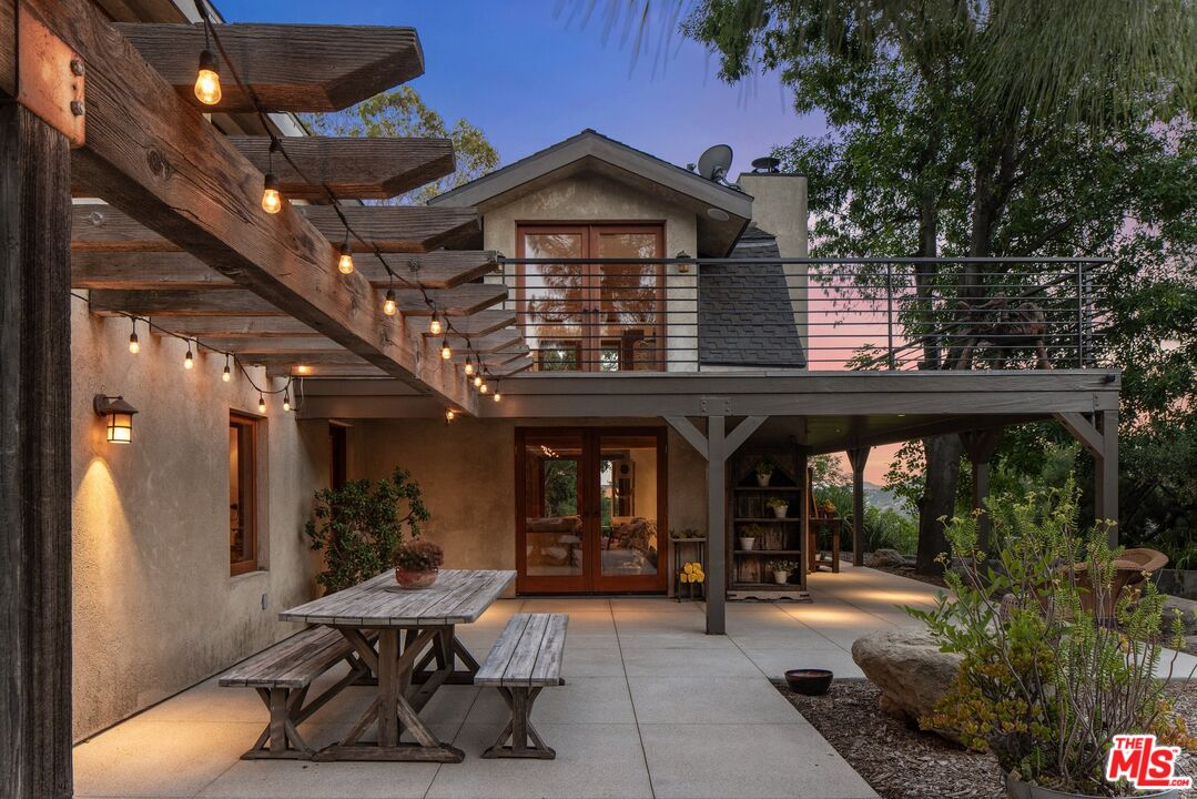 7336 Studio Road West Hills, CA 91304 - Photo 47 of 56 a view of a chairs and table in a patio