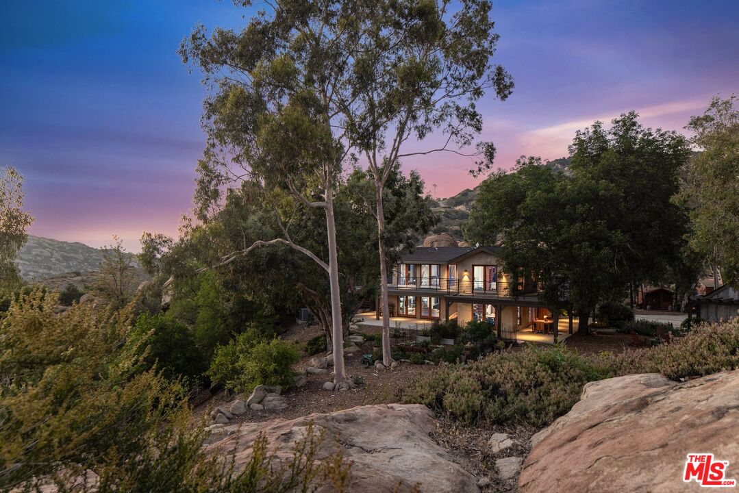 7336 Studio Road West Hills, CA 91304 - Photo 49 of 56 a backyard of a house with table and chairs