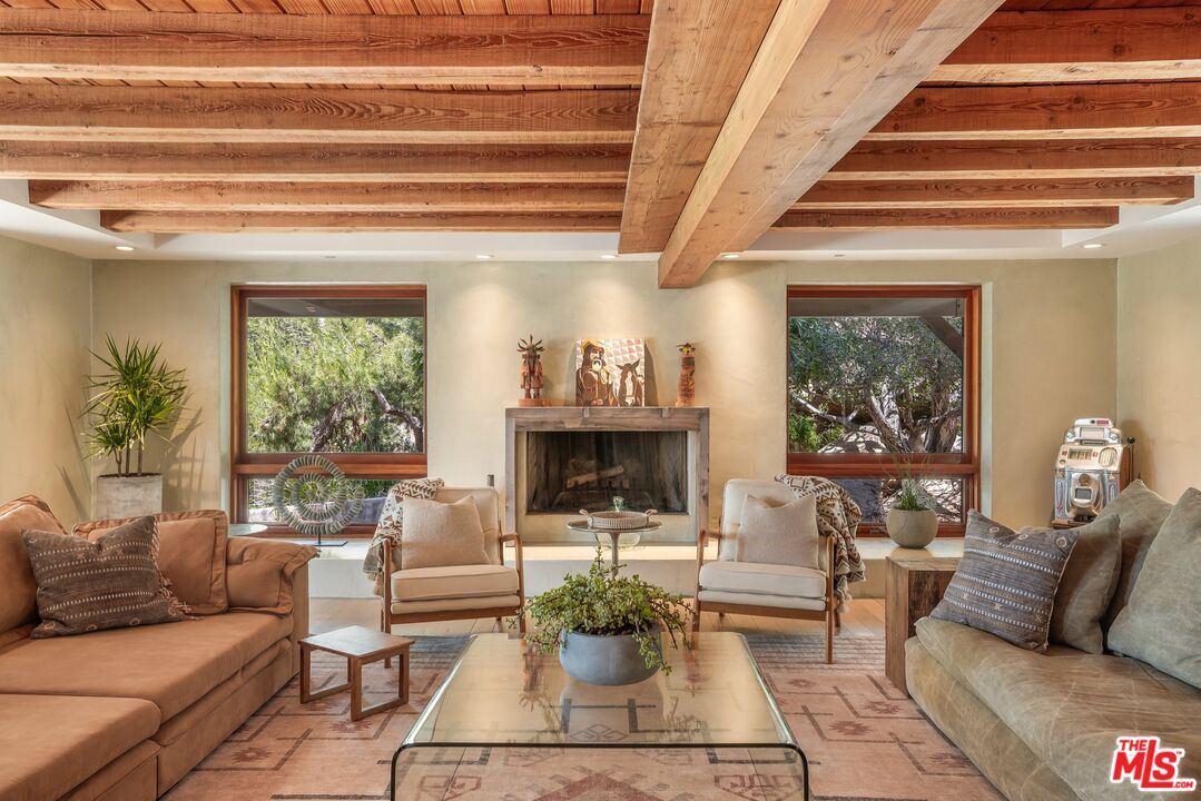 7336 Studio Road West Hills, CA 91304 - Photo 6 of 56 a living room with furniture and a fireplace