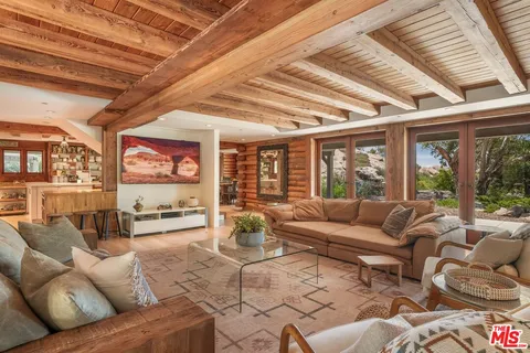 a kitchen with a sink a counter top space and furniture