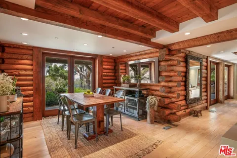 a kitchen with stainless steel appliances kitchen island granite countertop a refrigerator and a stove