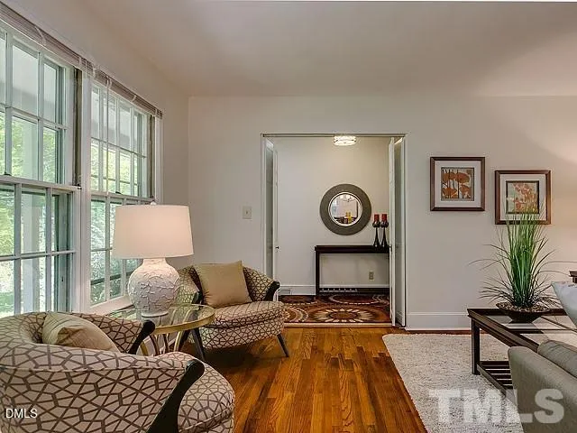 a living room with furniture and a window