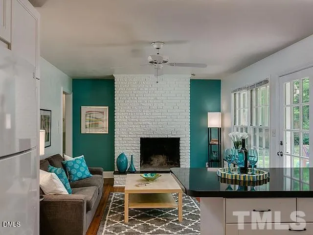 a living room with furniture and a fireplace