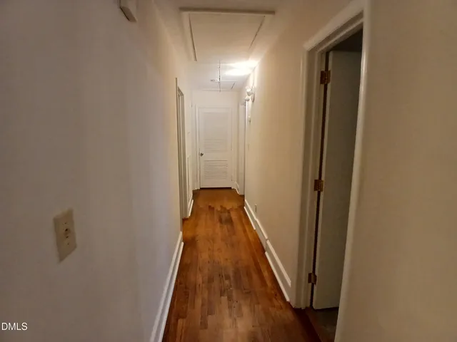 a view of a bathroom from a hallway