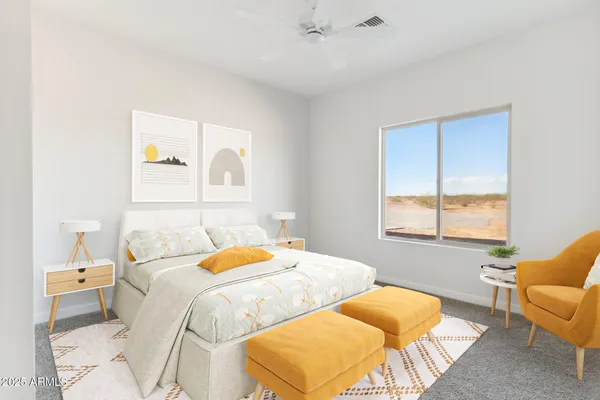 a bedroom with a bed and a couch