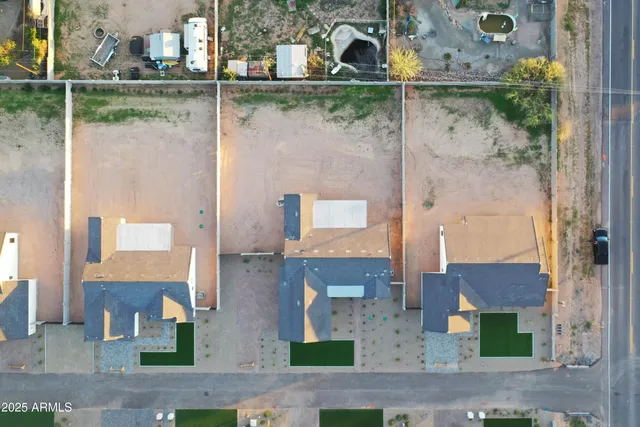 an aerial view of residential houses with outdoor space