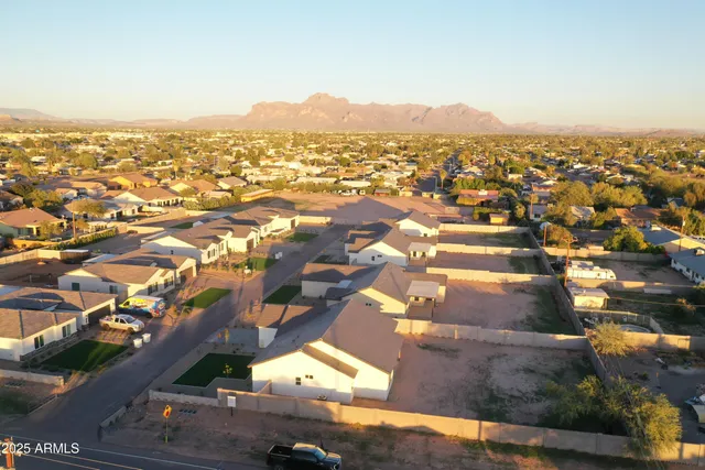 an aerial view of residential houses with outdoor space