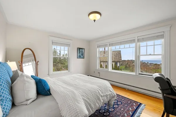 a view of room with window and a flat screen tv