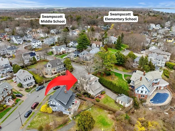 an aerial view of residential houses with outdoor space