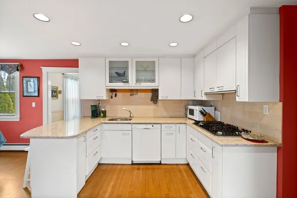 a kitchen that has a sink and cabinets in it