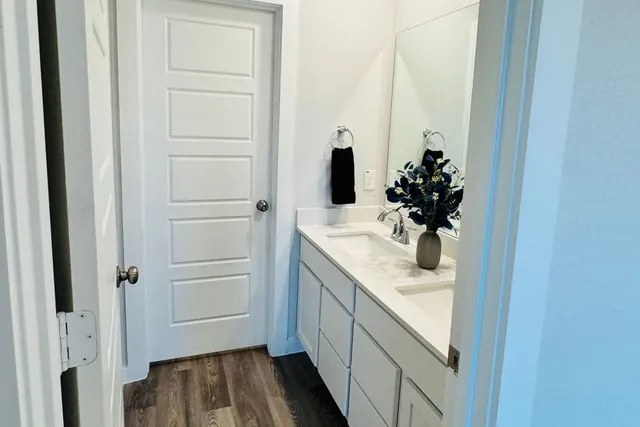 a living room with furniture and a dining table