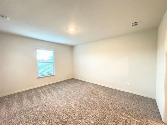 a room with a sink and a mirror