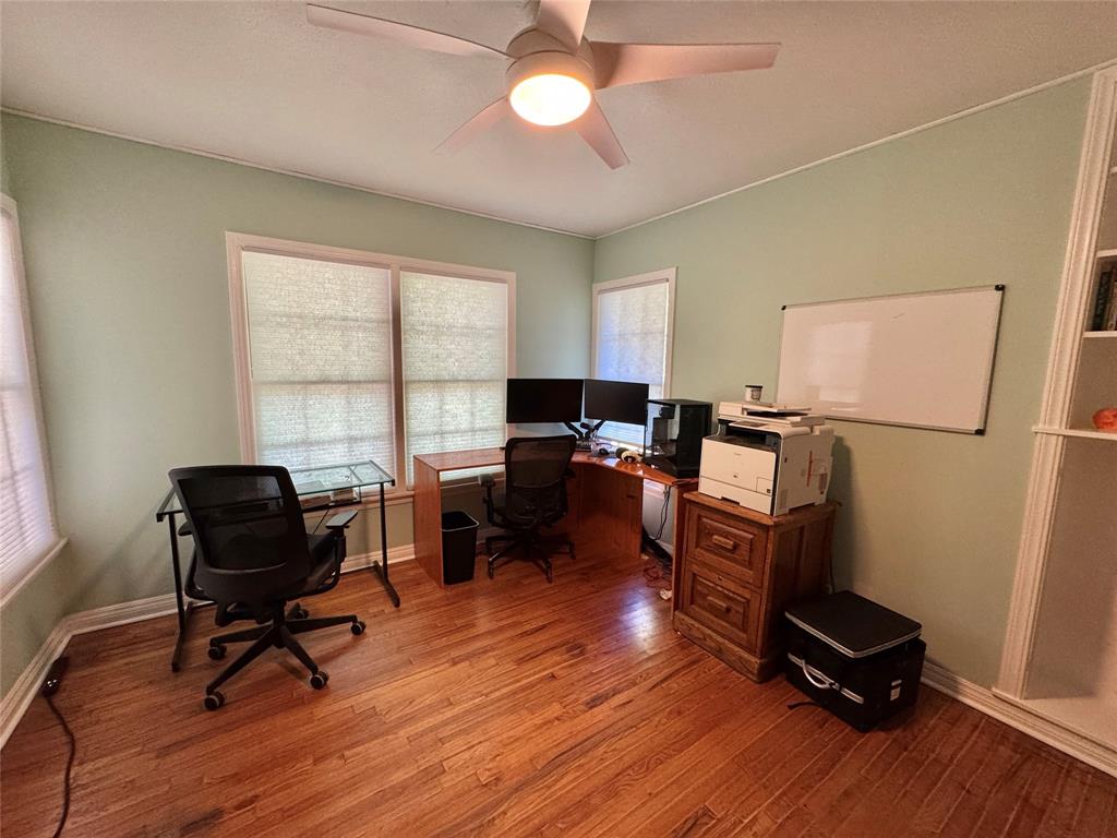 724 South Rusk Street Gainesville, TX 76240 - Photo 13 of 29 a view of a workspace with furniture and a window