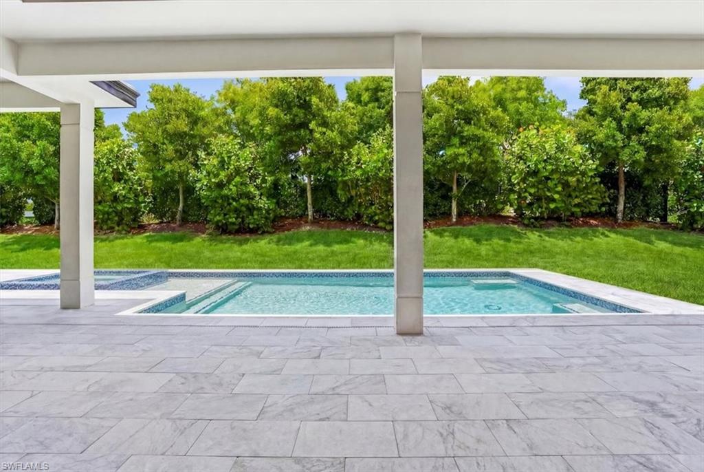 14318 Charthouse Circle Naples, FL 34114 - Photo 20 of 36 a view of backyard with green space