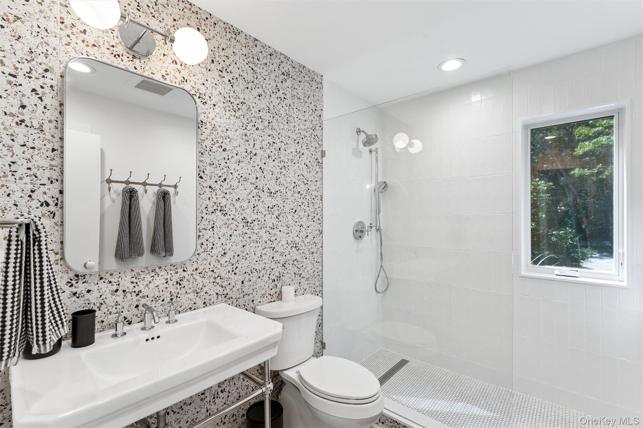 8 Deer Path Quogue, NY 11959 - Photo 13 of 23 Bathroom featuring walk in shower, recessed lighting, and tile walls