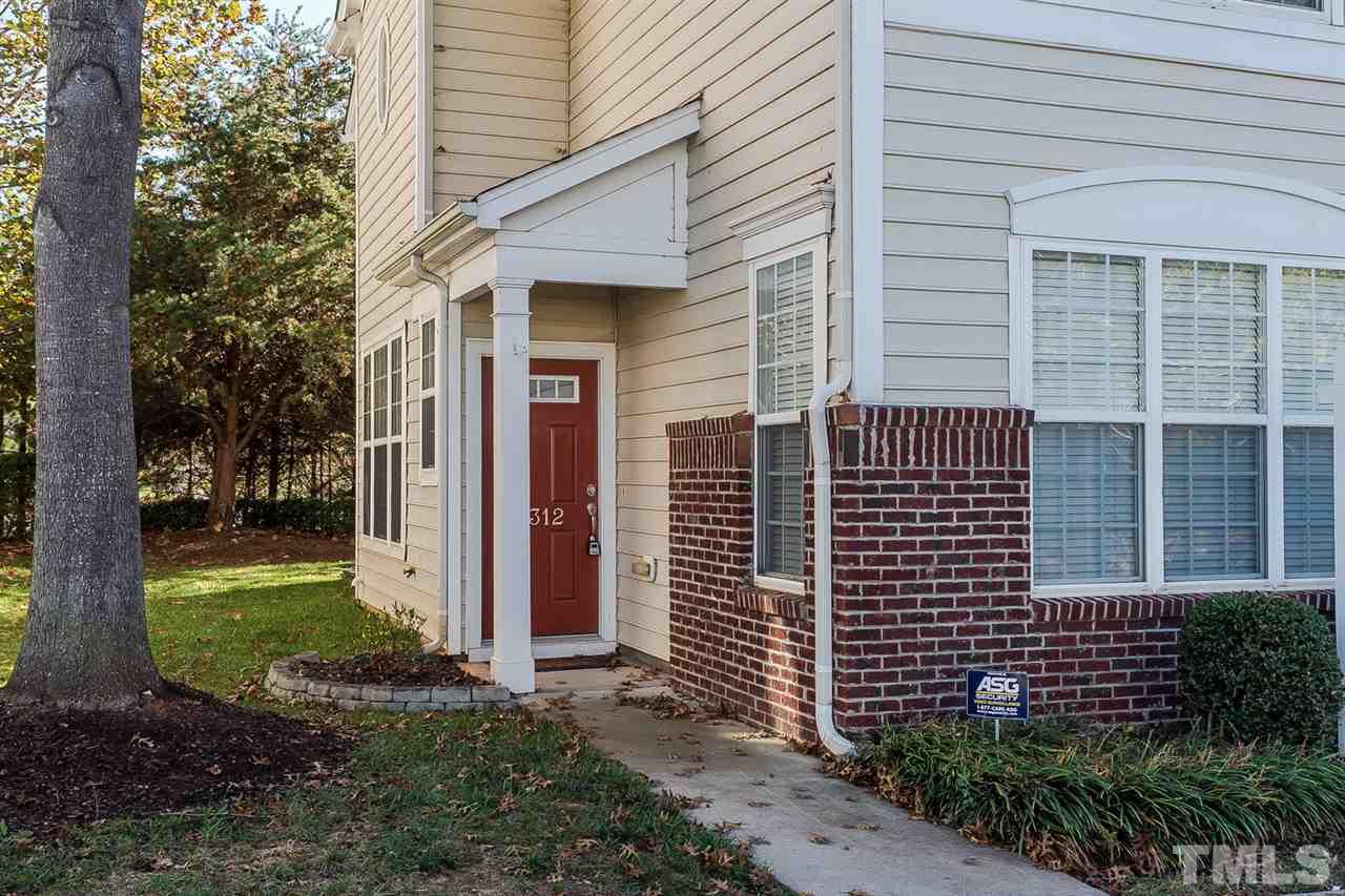 8312 City Loft Court Raleigh, NC 27613 - Photo 2 of 23 a front view of a house with garden
