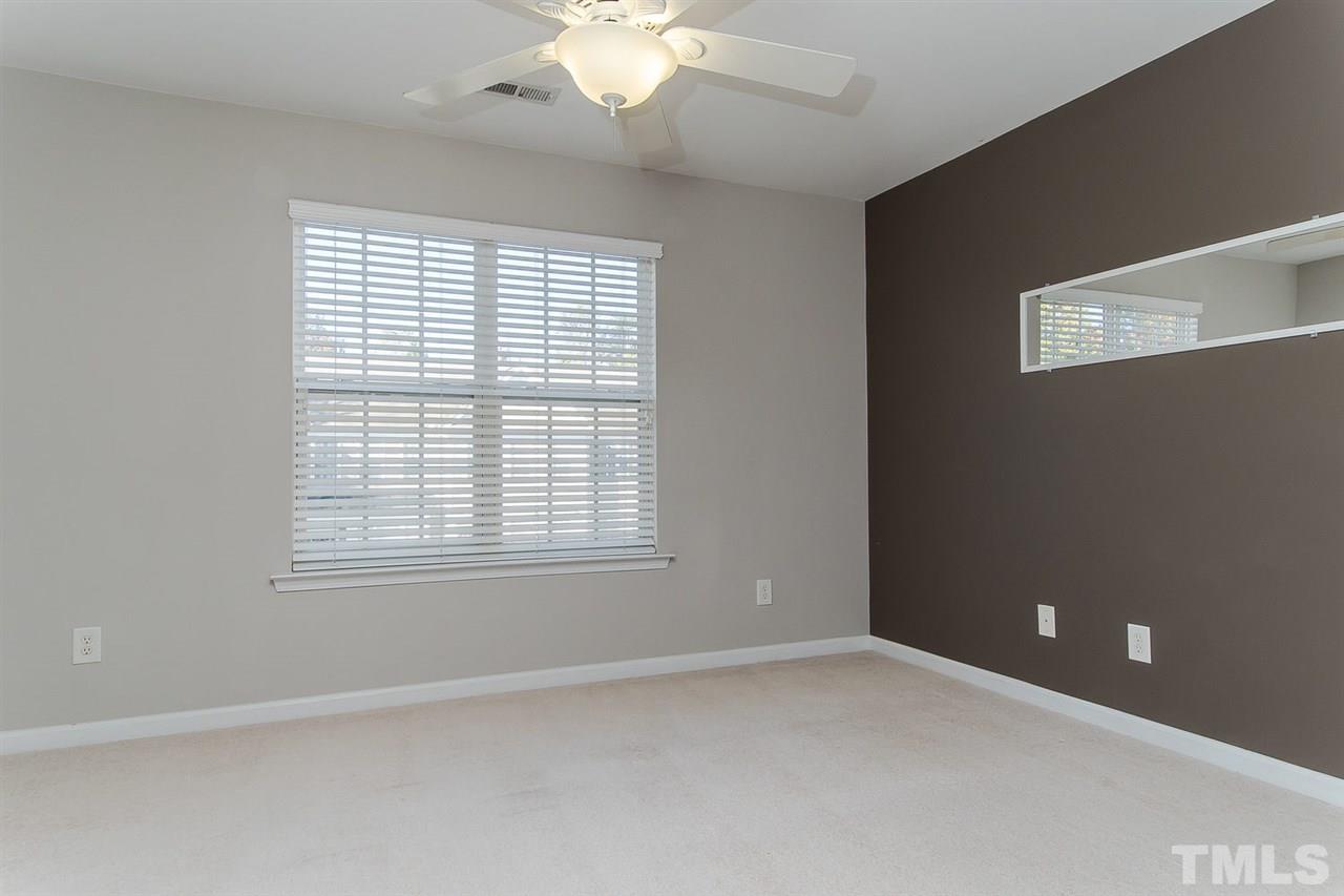 8312 City Loft Court Raleigh, NC 27613 - Photo 16 of 23 an empty room with a window