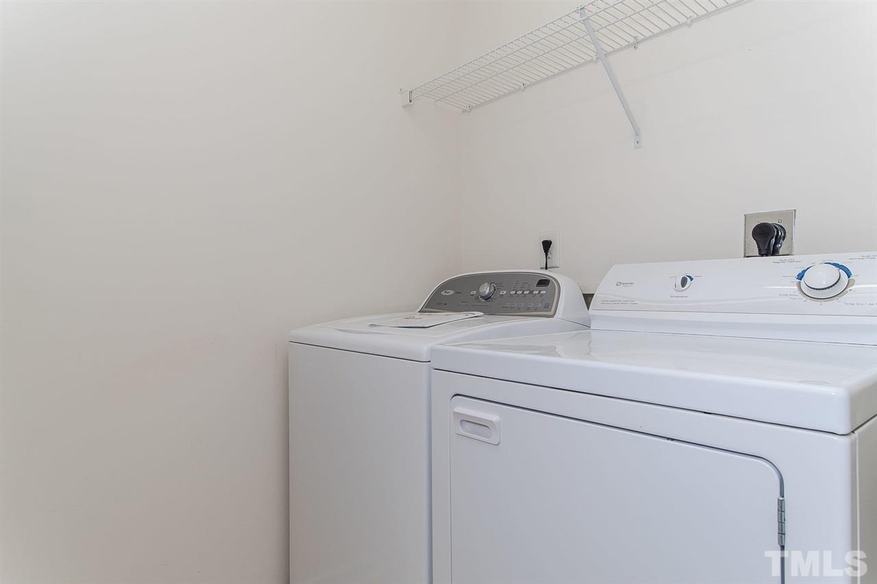 8312 City Loft Court Raleigh, NC 27613 - Photo 18 of 23 a utility room with dryer and washer
