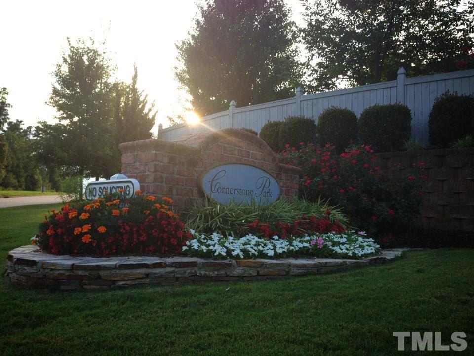 8312 City Loft Court Raleigh, NC 27613 - Photo 22 of 23 a building view with a garden space