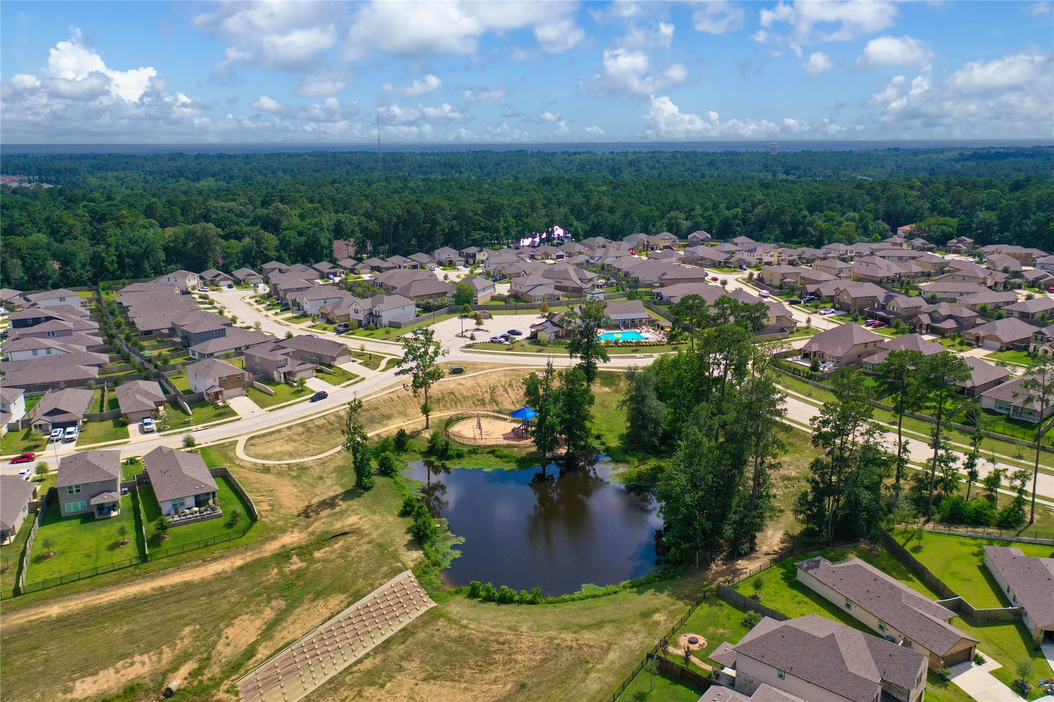 7080 Silverleaf Oak Street Conroe, TX 77304 - Photo 24 of 35 Walk along the shore or maybe catch some fish at the community lake.