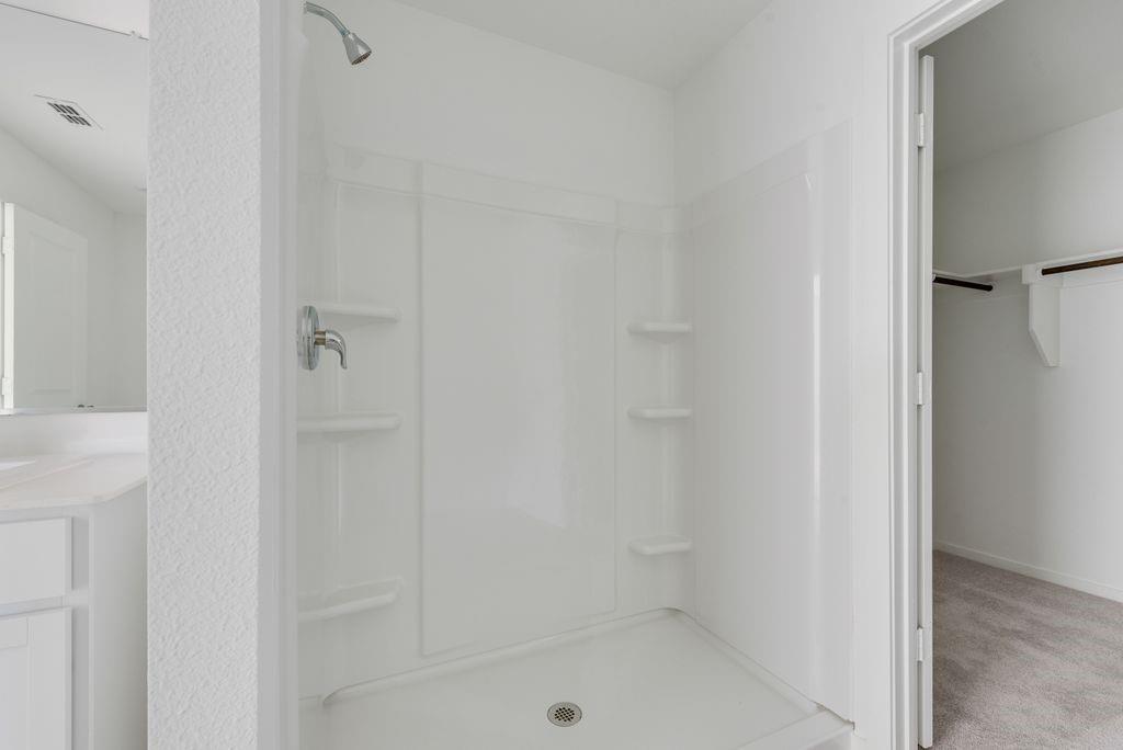 14212 Bacton Road Pilot Point, TX 76258 - Photo 23 of 24 a bathroom with a bath tub