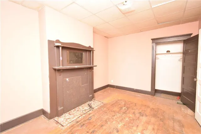 a view of a small space with wooden floor