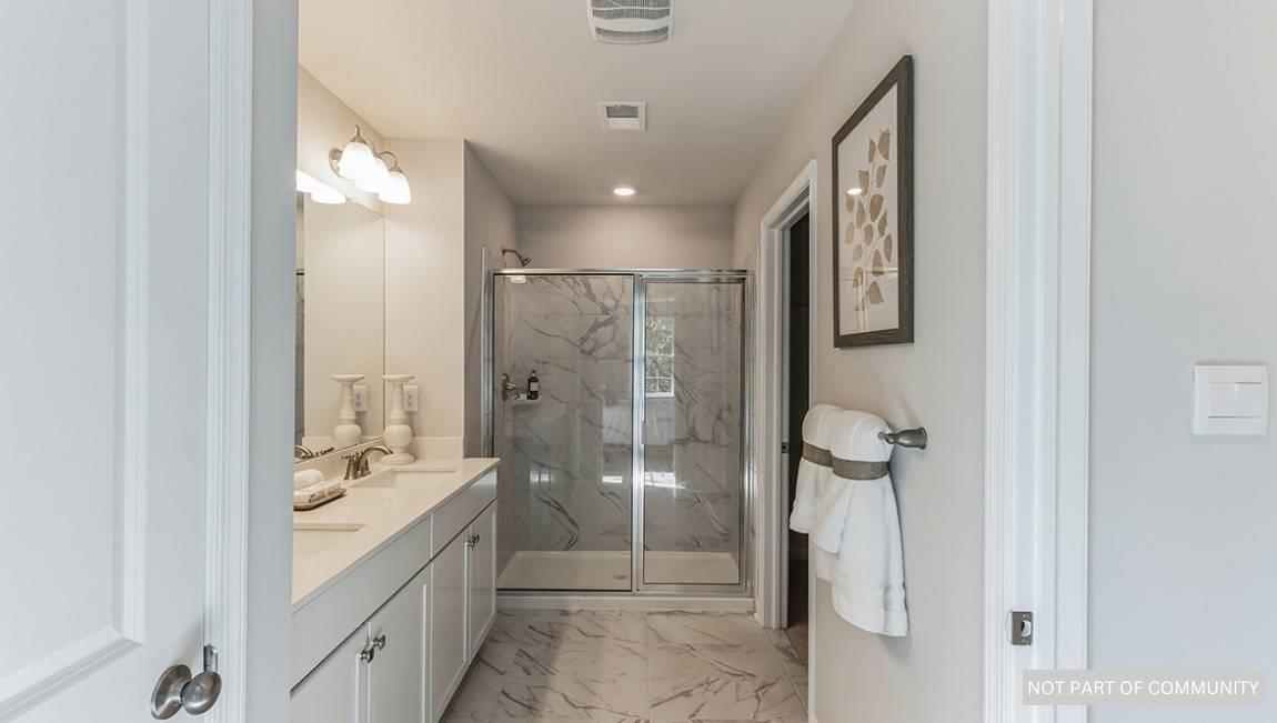 500 Scotty, Unit 1201 Rio Grande, NJ 08242 - Photo 12 of 25 a bathroom with a double vanity sink toilet and shower