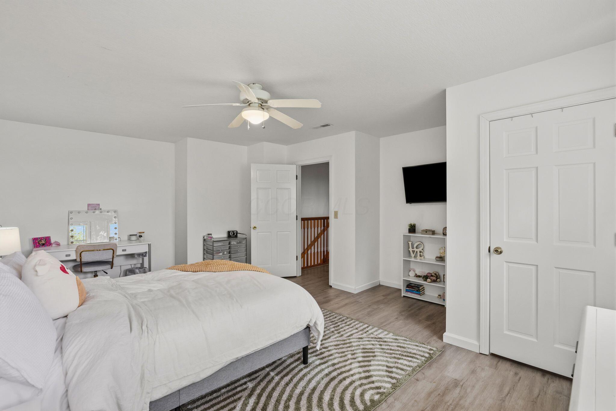 10446 Rich Hollow Road Southwest Lancaster, OH 43130 - Photo 60 of 83 Spacious room with light wood-finish flooring, white walls, and a ceiling fan with integrated lighting