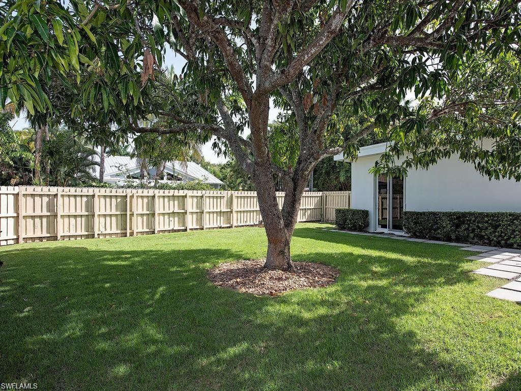 757 Broad Court South Naples, FL 34102 - Photo 11 of 12 a view of a garden with a tree