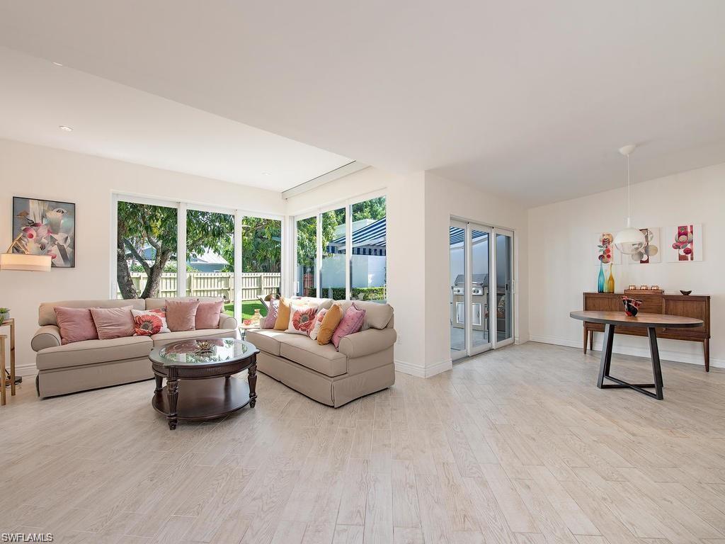 757 Broad Court South Naples, FL 34102 - Photo 3 of 12 a living room with furniture and a large window
