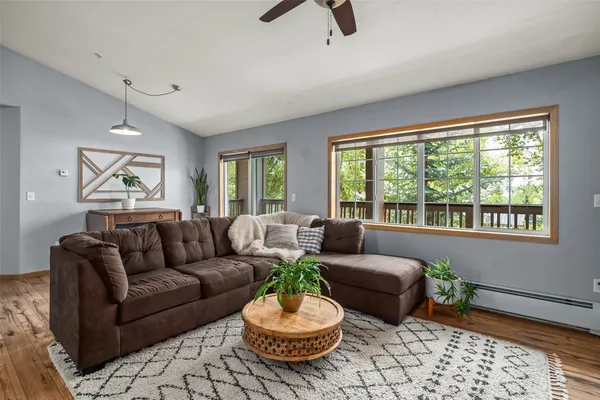 a living room with furniture and a large window