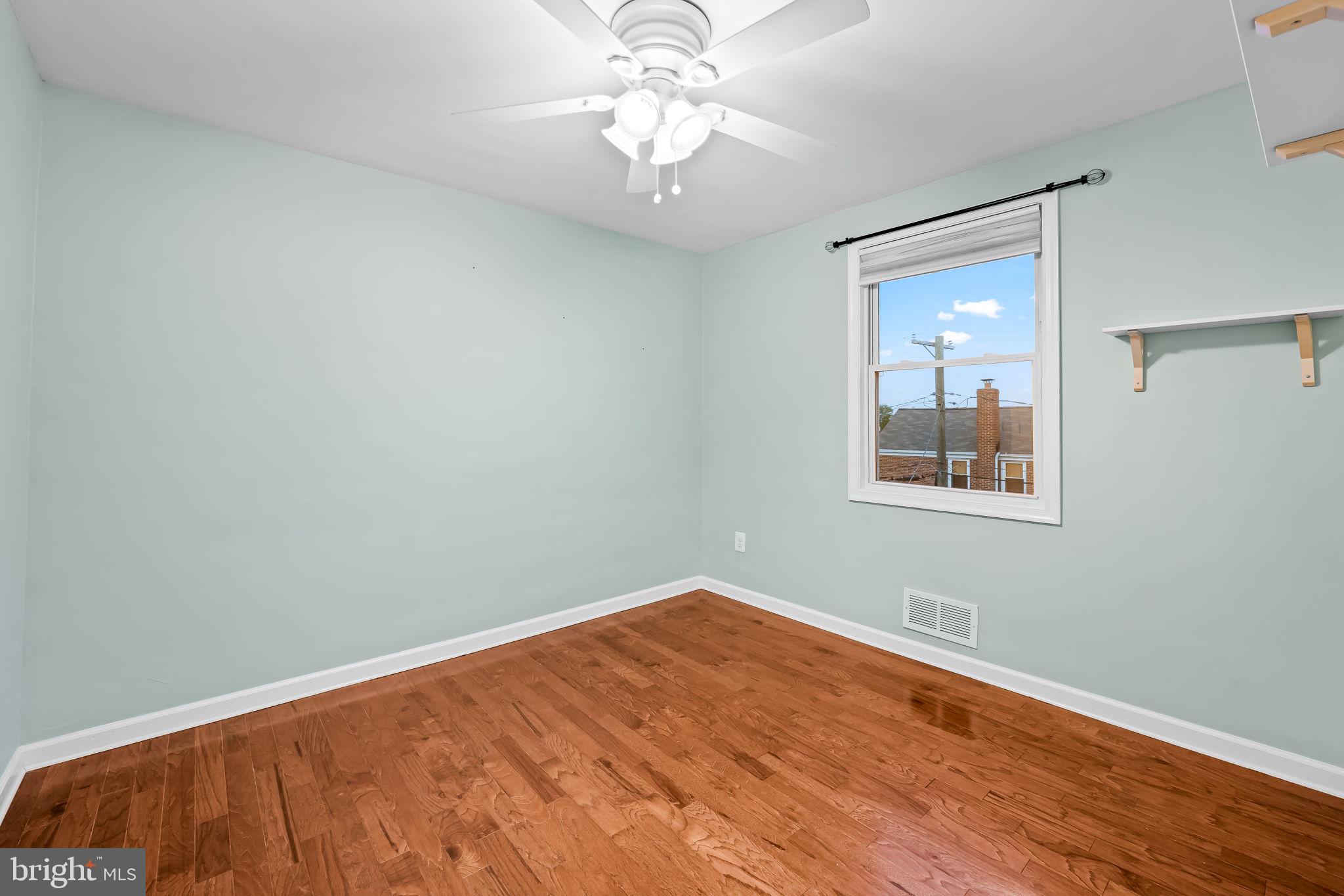 1817 Dunmere Road Baltimore, MD 21222 - Photo 17 of 27 a view of a room with a fan and a window