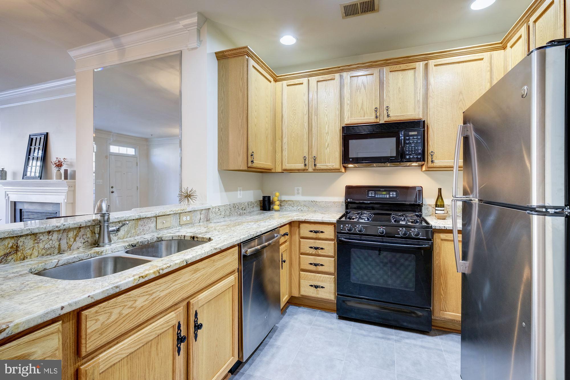 Kitchen with gas cooking &  SS refrigerator