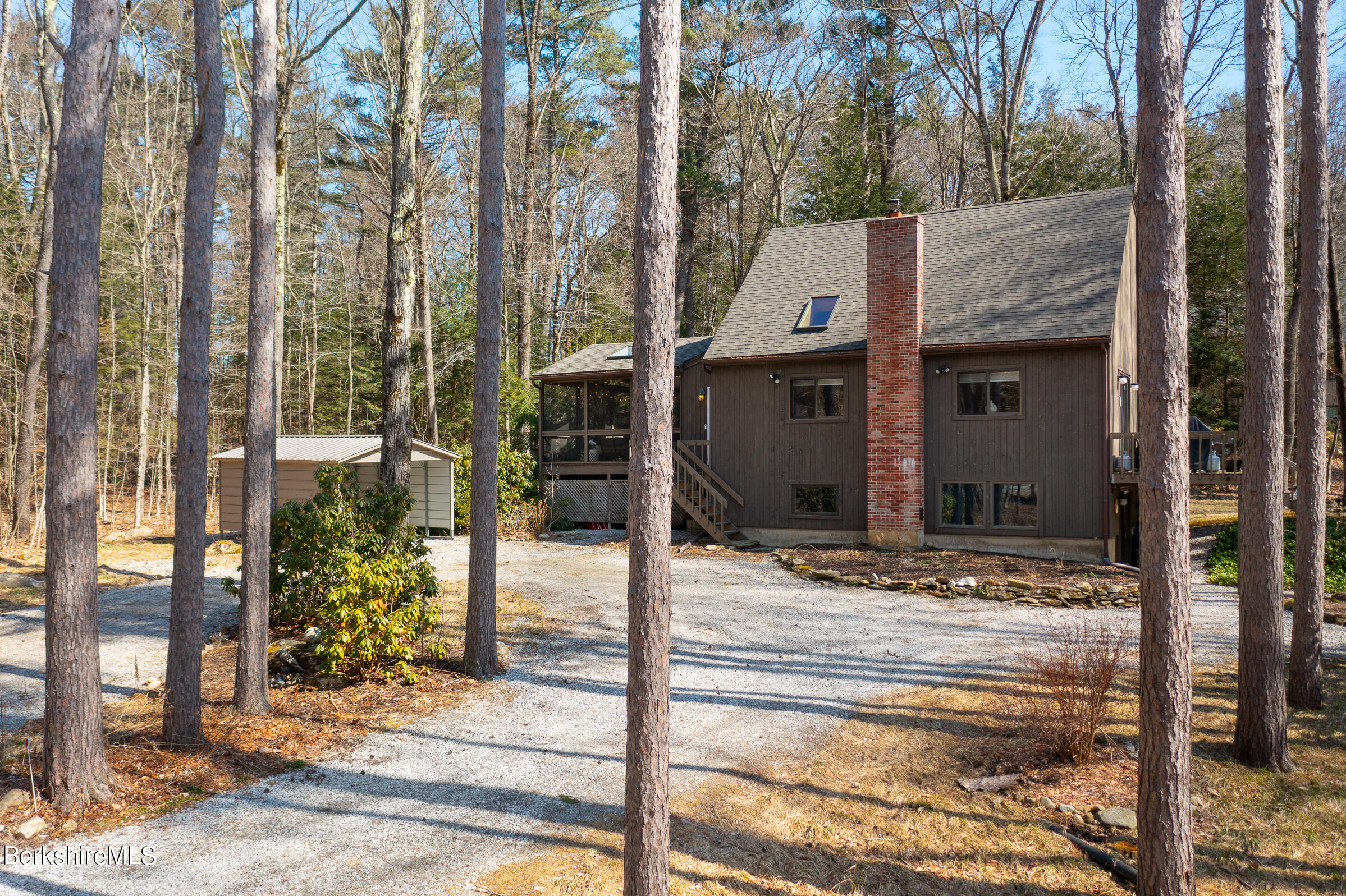 a view of a house with a tree
