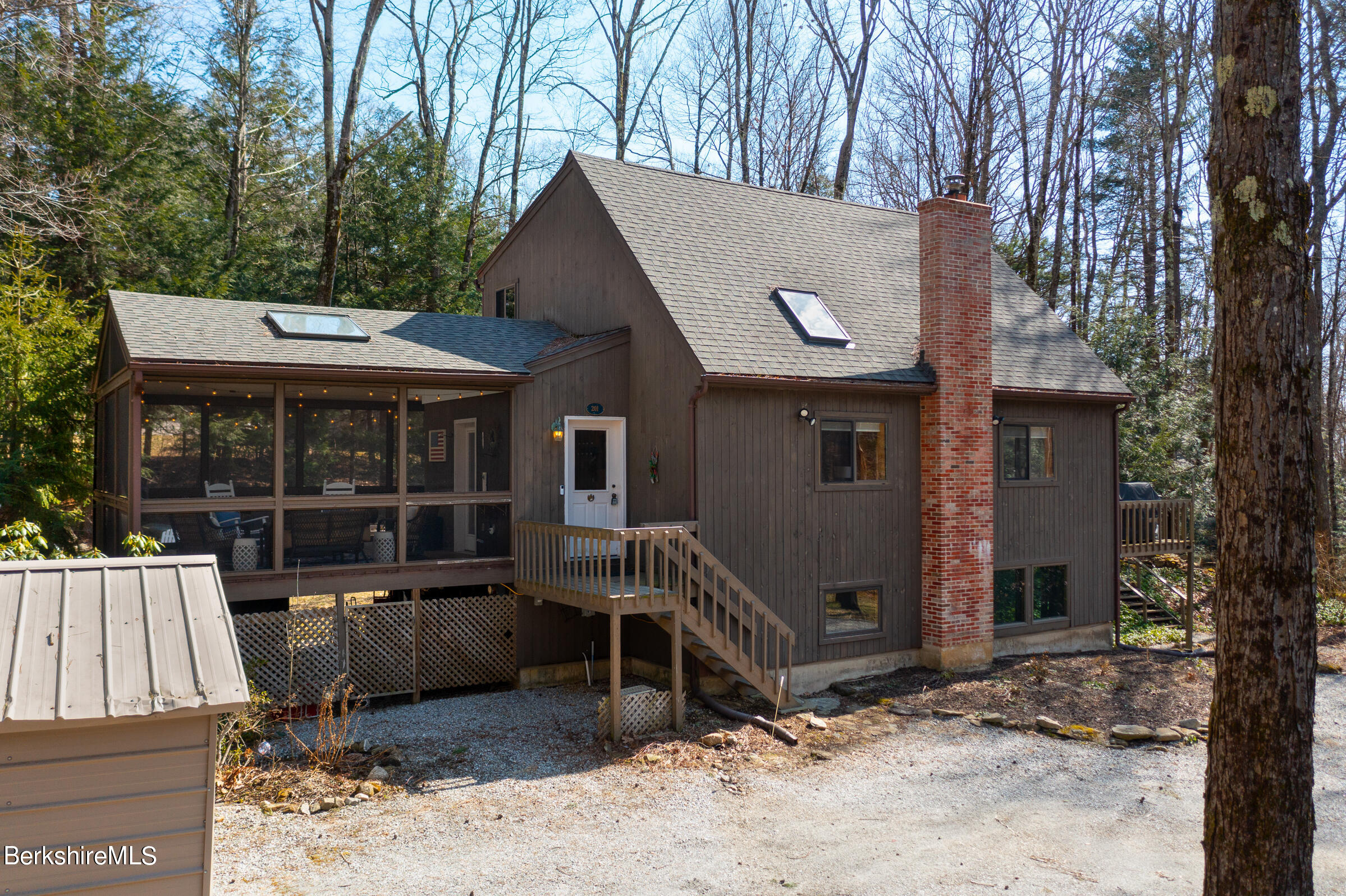 201 Judd Road Otis, MA 01253 - Photo 2 of 38 a view of a house with a yard and sitting area