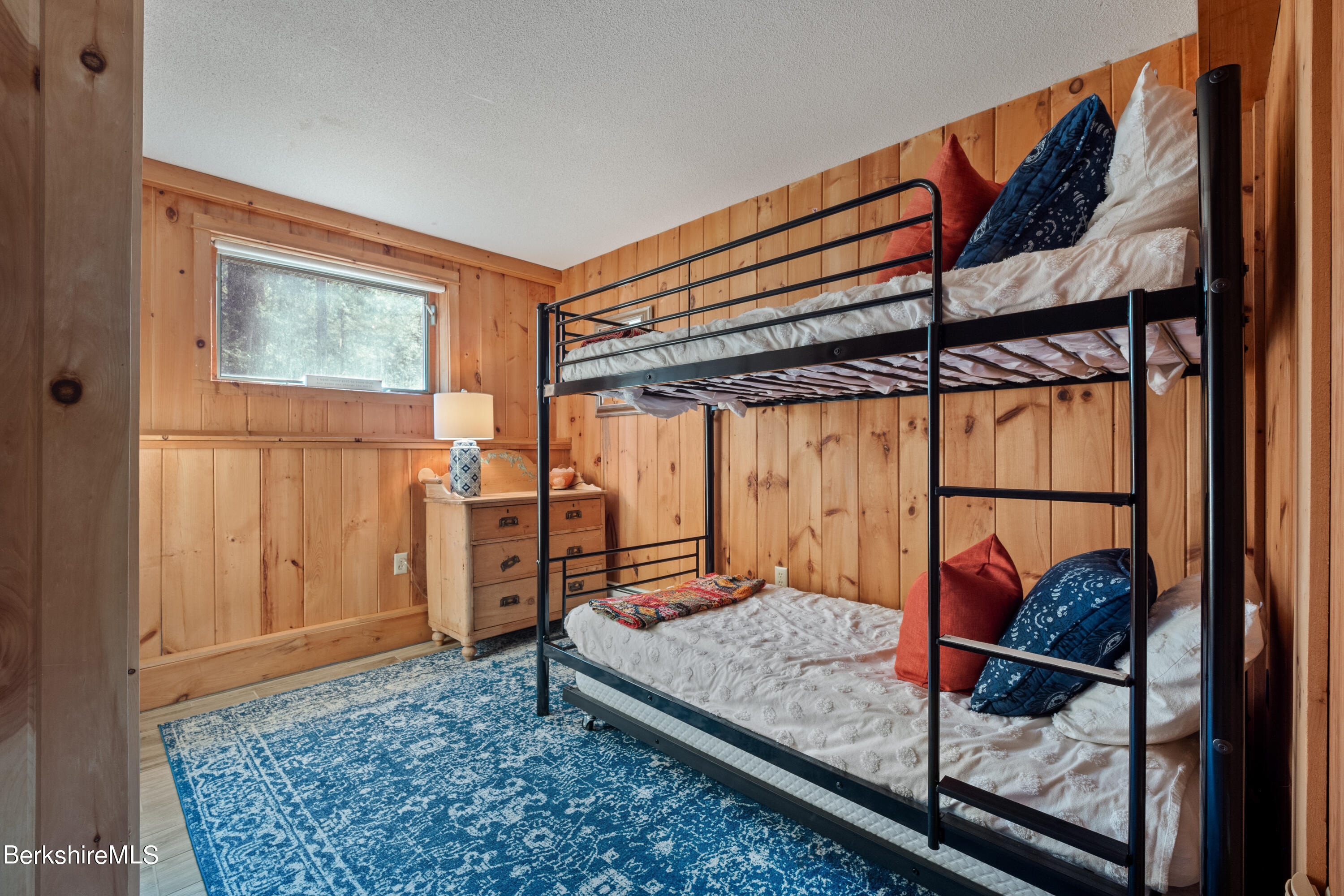 201 Judd Road Otis, MA 01253 - Photo 30 of 38 a bedroom with a bed and wooden floor