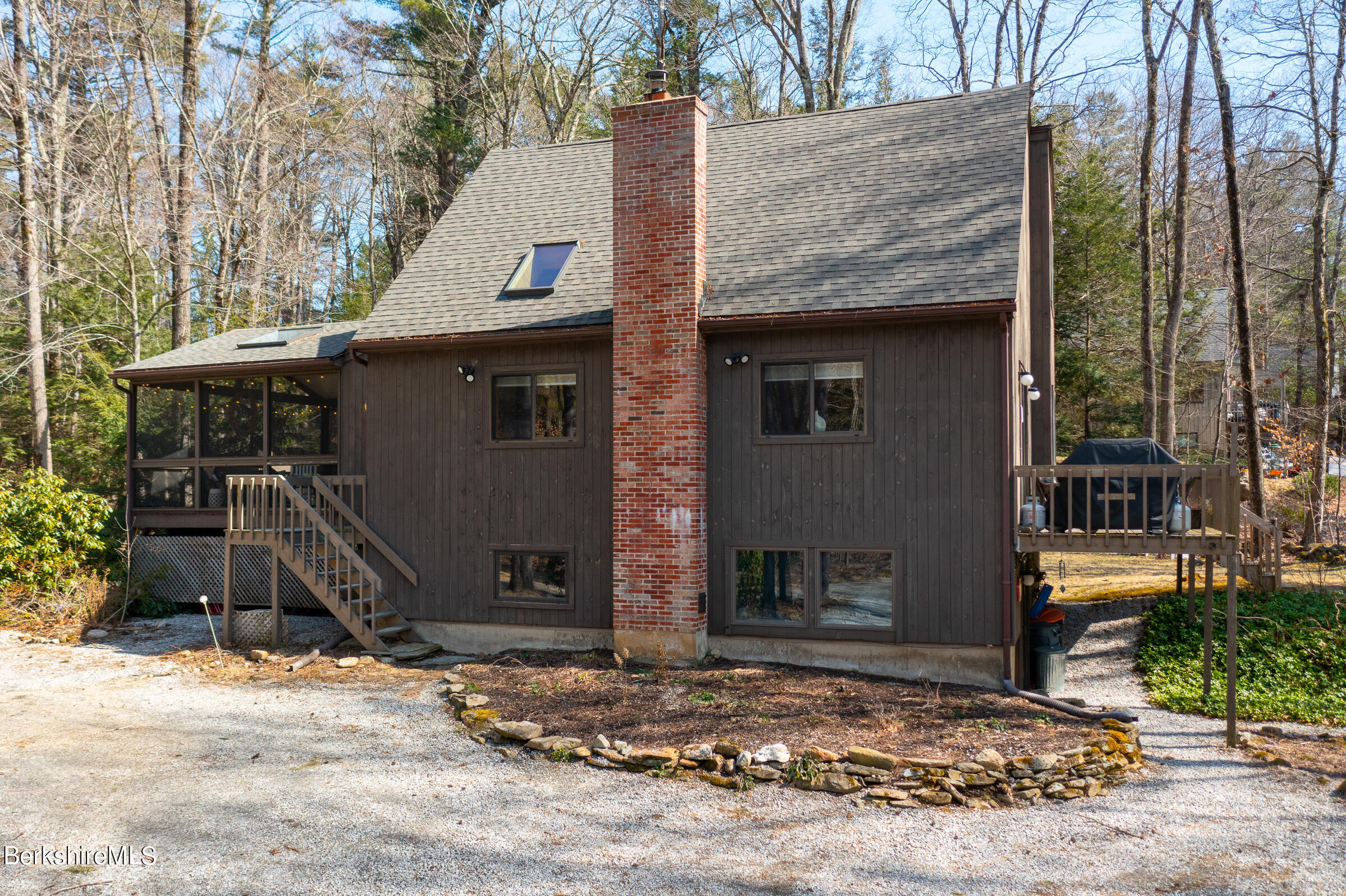 201 Judd Road Otis, MA 01253 - Photo 4 of 38 a front view of a house with garden