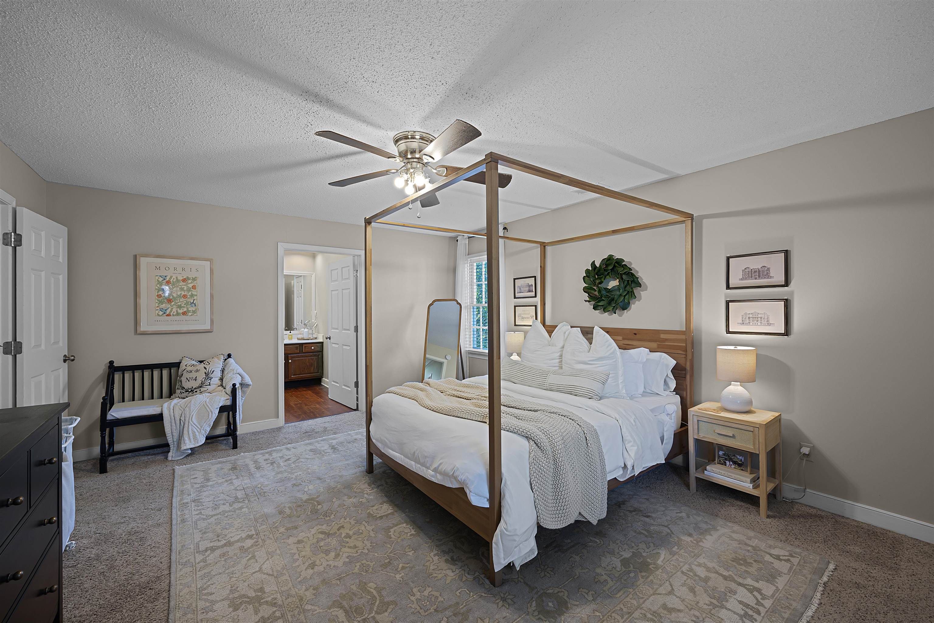 319 East Harpers Ferry Road Collierville, TN 38017 - Photo 15 of 27 Carpeted bedroom featuring ceiling fan, a textured ceiling, and connected bathroom