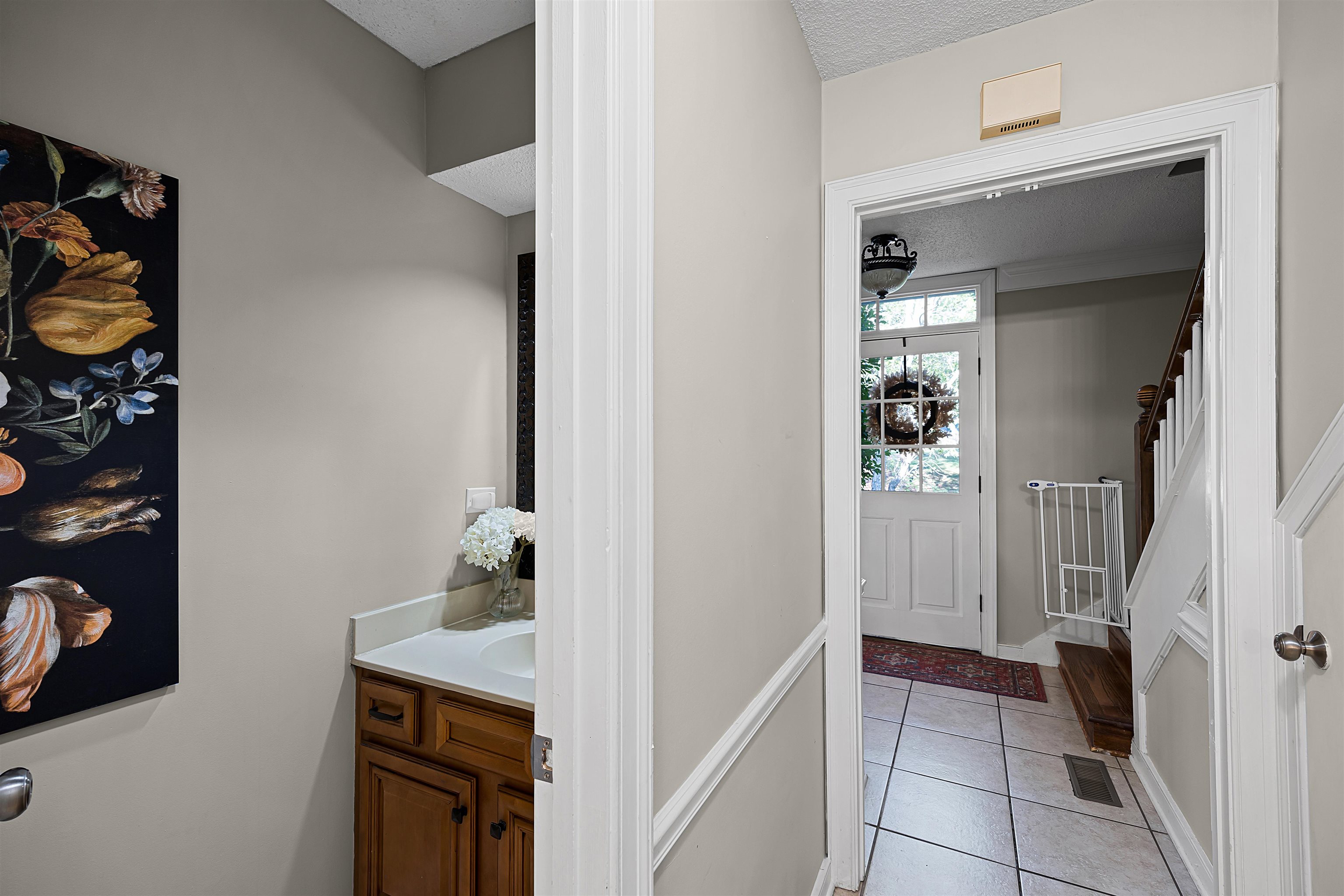 319 East Harpers Ferry Road Collierville, TN 38017 - Photo 6 of 27 Bathroom with tile patterned flooring, a textured ceiling, and vanity