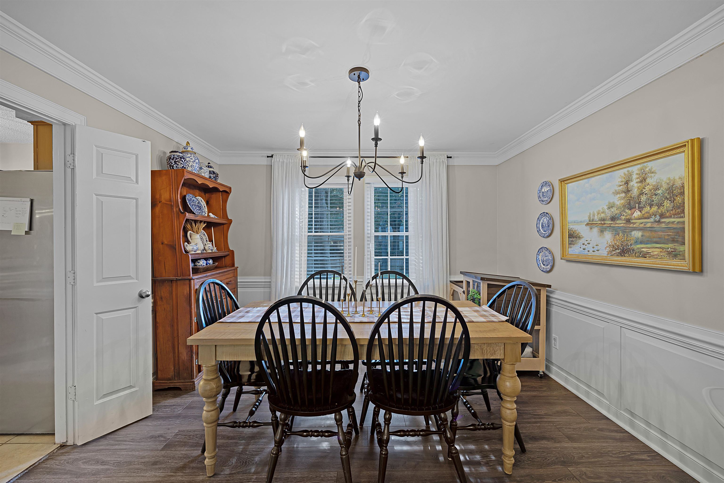 319 East Harpers Ferry Road Collierville, TN 38017 - Photo 7 of 27 Dining room with dark hardwood / wood-style flooring, an inviting chandelier, and crown molding