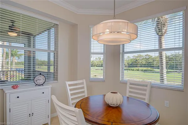 a dining room with furniture and window