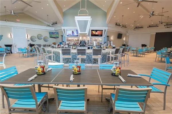 a dining room with furniture window and view of lake