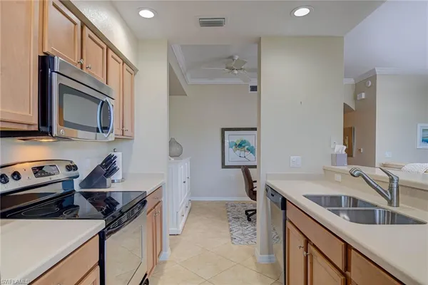 a kitchen that has a sink and a stove