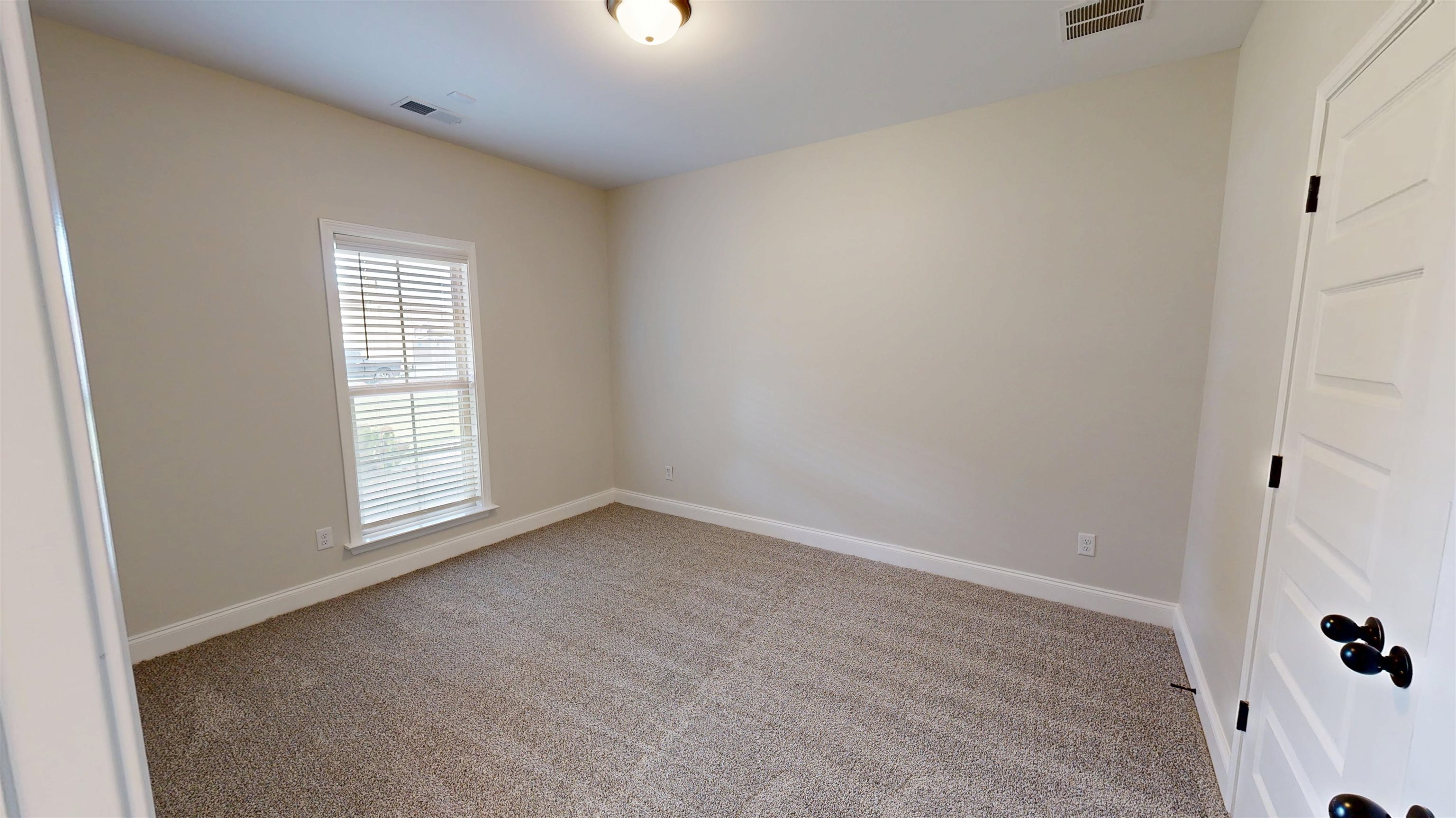 5217 Nail Road Olive Branch, MS 38654 - Photo 18 of 35 Spare room featuring light carpet and baseboards