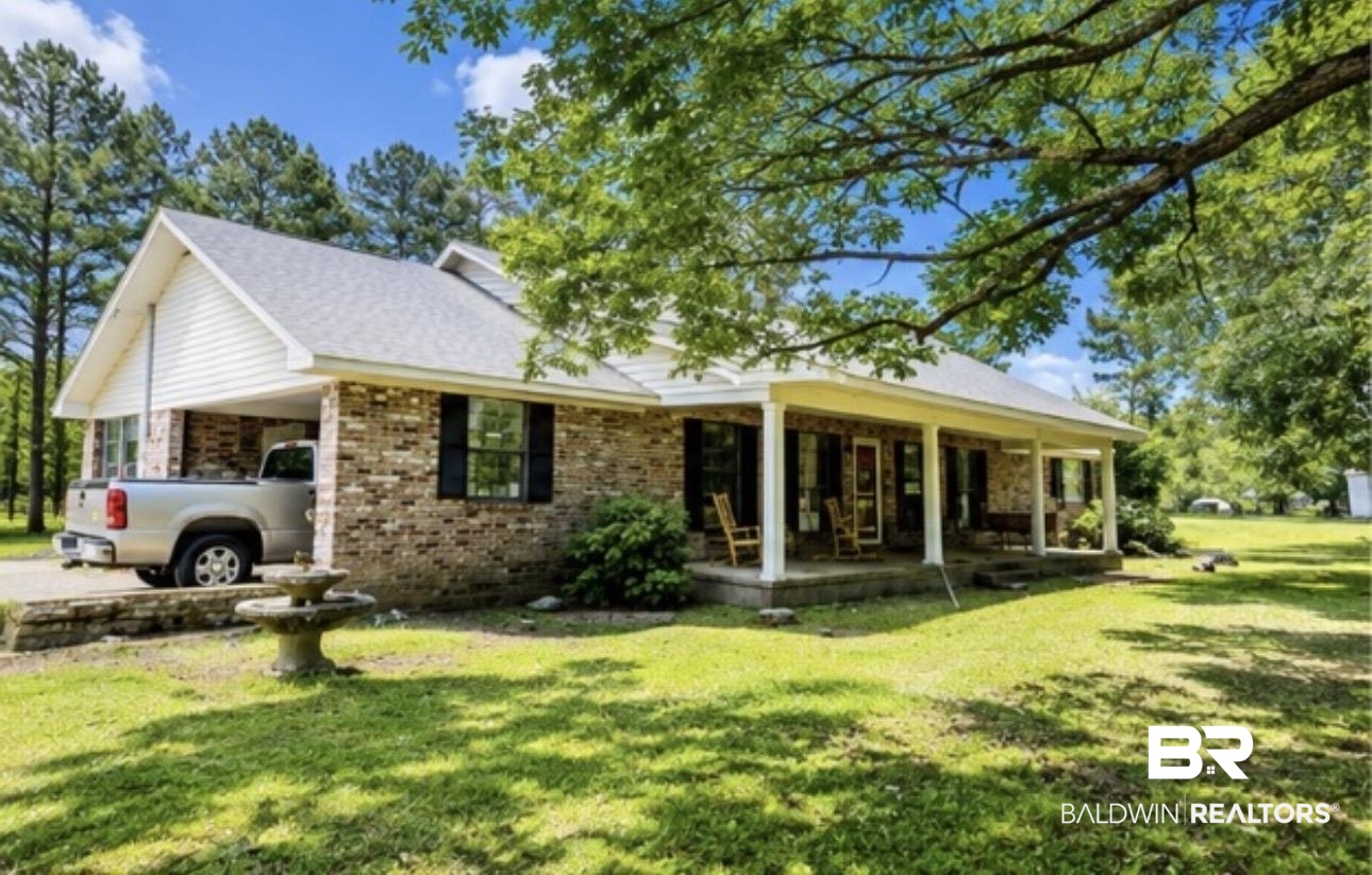 12092 Gantt Red Level Road Andalusia, AL 36421 - Photo 6 of 33 Brick exterior with white siding accents and a light gray shingle roof