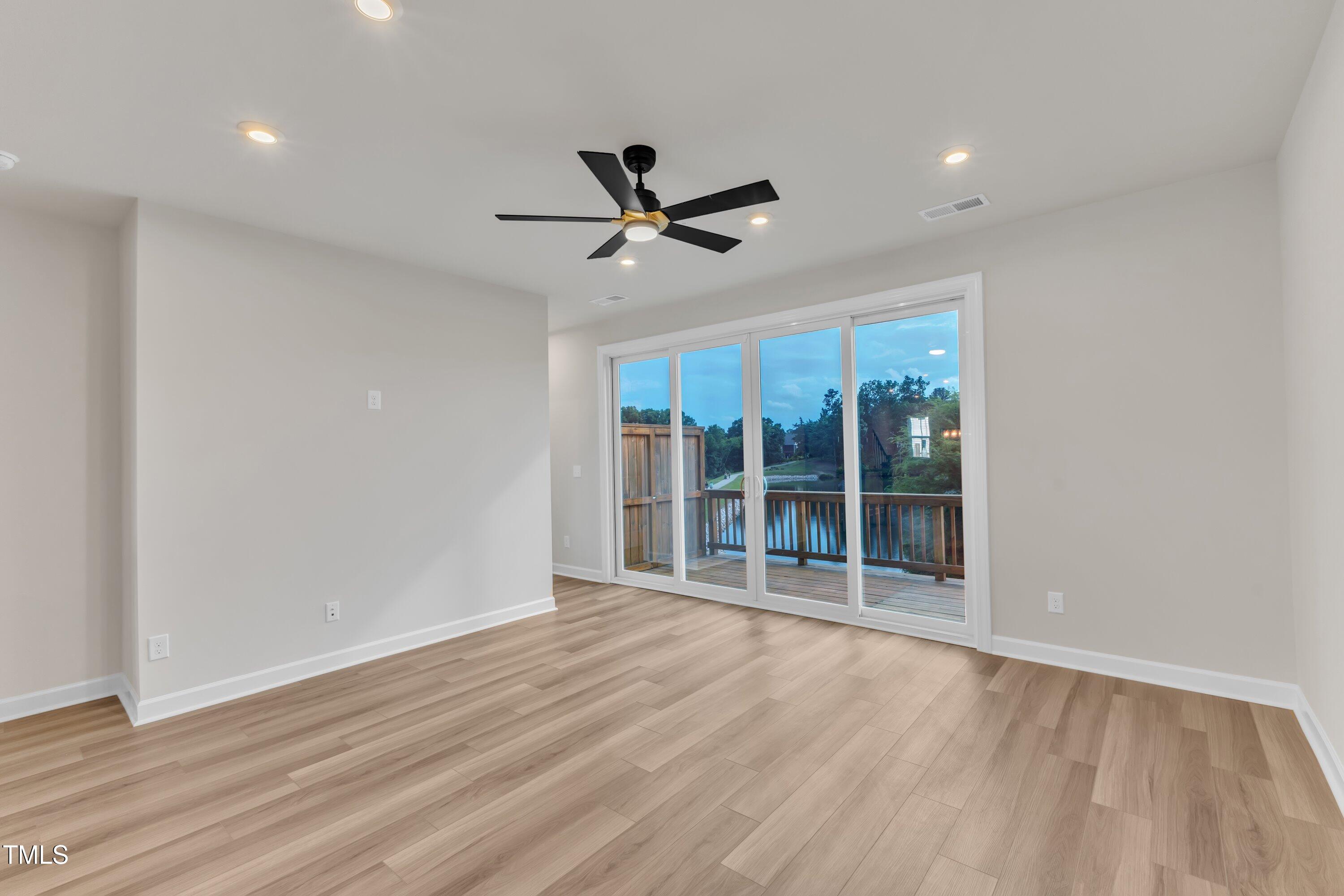 816 Lilyquist Way Wake Forest, NC 27587 - Photo 13 of 53 a view of an empty room with a window